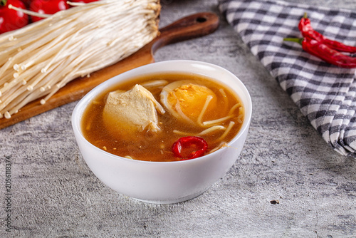 Tableau sur toile Japanese miso soup with tofu, egg, enoki mushrooms, and red chili peppers