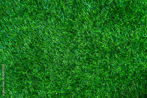 Top-down view of lush green artificial grass texture, perfect for modern wedding decorations, event backdrops, and floral arrangements.