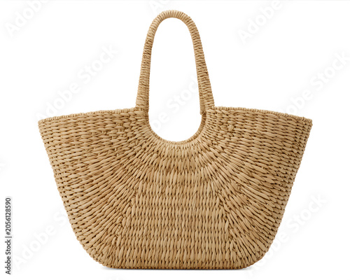 Woven straw tote bag natural fiber beach accessory for summer travel isolated on white background.