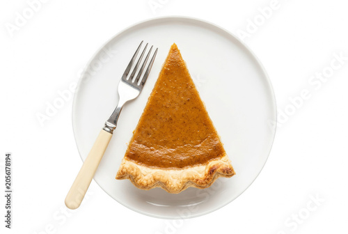Traditional Homemade Pumpkin Pie Slice on White Plate with Fork