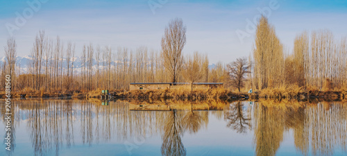 The natural beauty of the Tianshan Mountains and Swan Lake in winter in Xinjiang, China on March 3, 2023