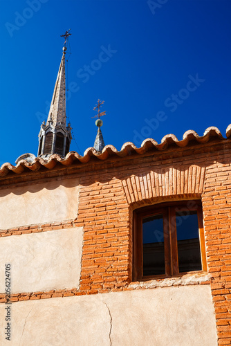 Church Spire and Traditional Window in San Carlos del Valle
