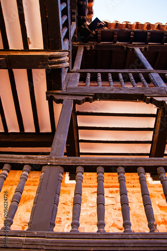 Traditional Wooden Balconies and Brick Wall Detail