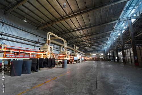 Plate processing machinery and equipment are located in a factory in North China