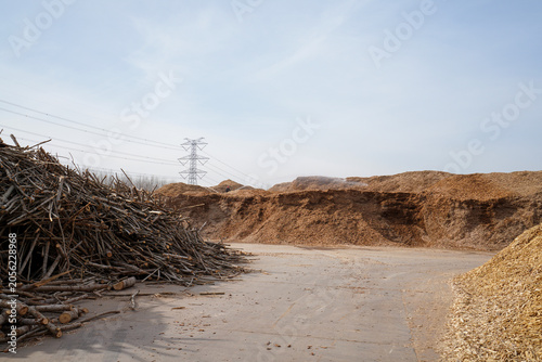 Wood chips and raw materials are piled together in a factory in North China