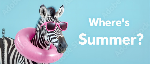 Trendy zebra in sunglasses with a colorful inflatable pool ring standing next to a “Where is Summer” sign on a blue studio backdrop, playful vacation-themed concept