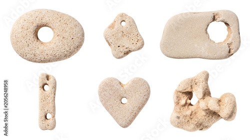Canvas-taulu Assortment of unique natural hag stones with holes and porous textures, isolated on a transparent background