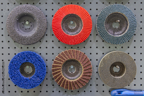 Various Types of Angle Grinder Abrasive Discs Tools at Pegboard in Workshop