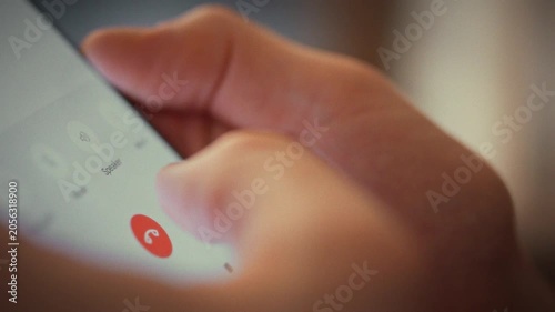 Man abruptly ends call by pressing red button, cutting off the conversation with his interlocutor. This simple gesture reflects how quickly people can terminate digital dialogues in everyday settings