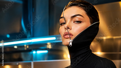 Woman with open zipper across face, identity and inner self surreal concept