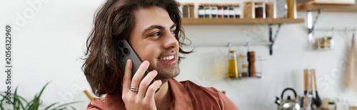 Foto Engaging in a phone call, a young man showcases an effortless modern lifestyle a