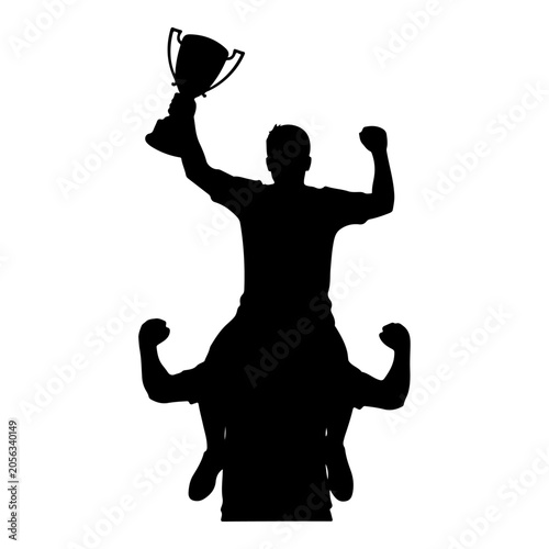 Tablou pe pânză Silhouette of a triumphant athlete holding a trophy aloft while being carried by a teammate