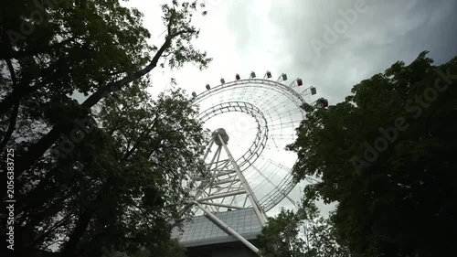 View of the Ferris wheel from below. Ferris wheel. Filmed in motion