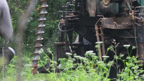 engineering geological surveys, environmental soil analysis, a drill drills into the soil