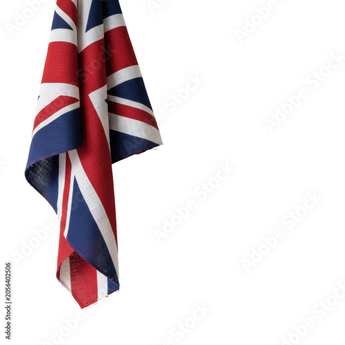 Large british flag with visible woven fabric textures cascading down from the top left corner against a minimalist white background, sense of national pride