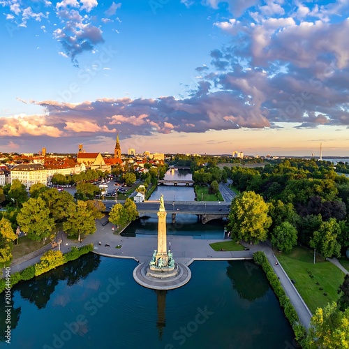 Aerial view of a city park with a large monument