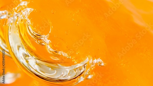Fresh Orange Juice Splash with Vibrant Citrus Liquid and Dynamic Flowing Texture.