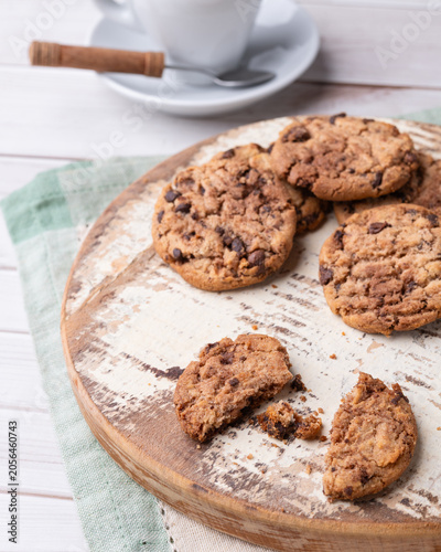 Chocolate chip cookies over wooden board