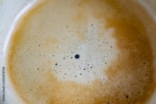 Close-up of fresh espresso foam with coffee bubble