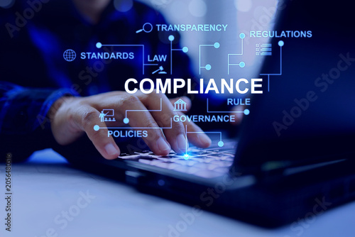Foto compliance concept with business person using computer to check and submit docum