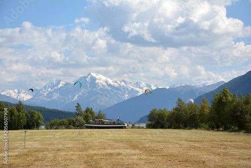 Bild auf Leinwand Paragliding   in lake Reschen/Resia, South Tirol, Italy