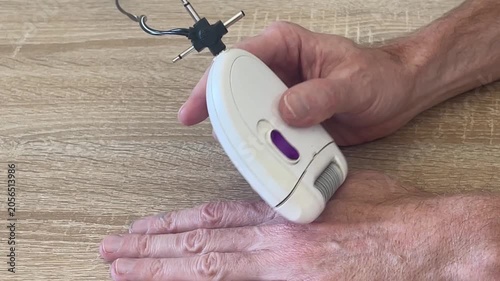 epilator whirring when removing hair from skin