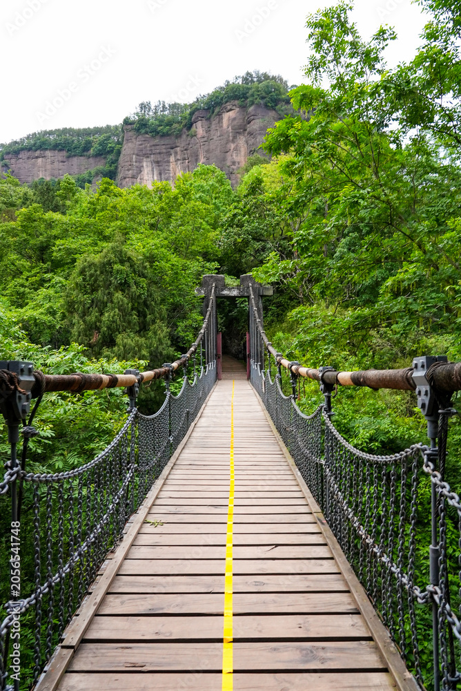 Fototapeta premium Wooden suspension bridge at Jianmen Pass, Sichuan, China