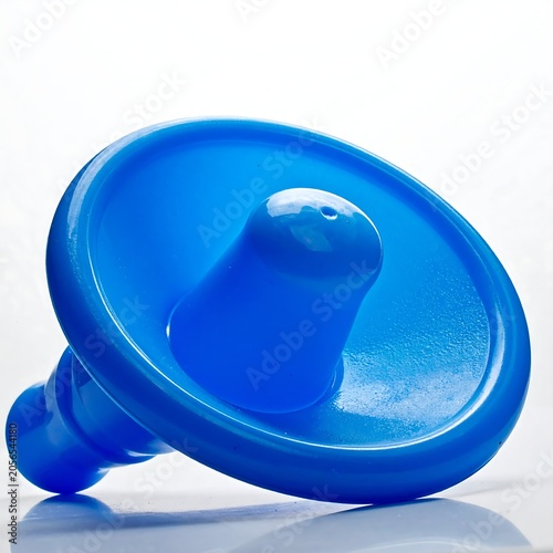 Bright Blue Plastic Suction Cup Lying on White Background