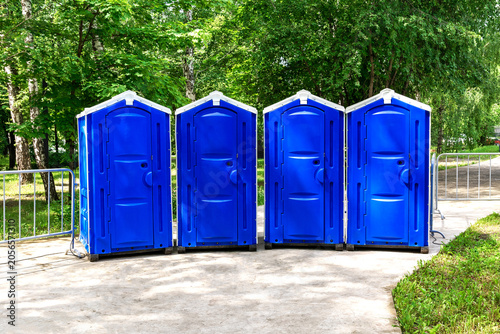 A few portable blue toilets were set up in the city park.
