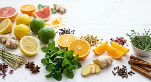 Vibrant Collection of Fresh Citrus Fruits, Ginger, and Mint for Refreshing Drinks and Culinary Creations