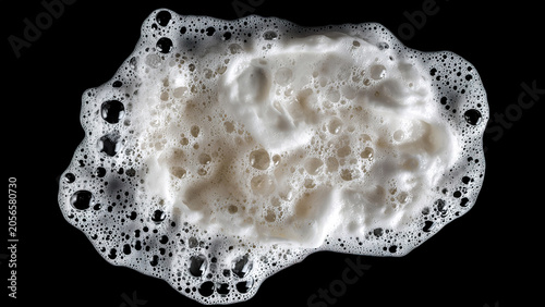 white soap foam splash isolated on black background 