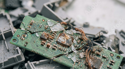 Broken and Burnt Circuit Board with Exposed Wires and Glass Shards