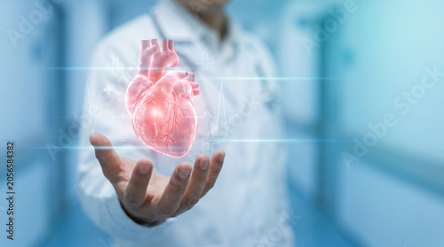 Obraz na plátně Doctor presenting holographic human heart with cardiology interface for healthca