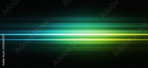 Abstract light trails with green and blue neon glow on dark background