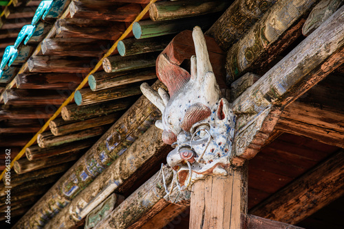 Tableau sur toile Yungang, China - May 9 2026: An intricate, weathered dragon head wood carving se