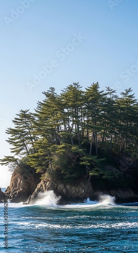 Waves crashing on rocky island shore.