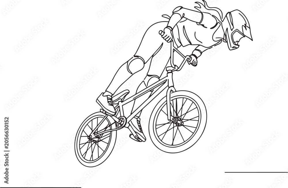 Obraz premium BMX rider in action performing a stunt with focused determination and skill.