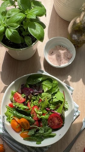 Healthy fresh tomato and arugula salad preparation