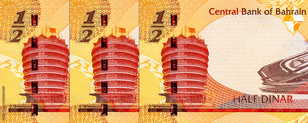 Fototapeta premium Bahraini half dinar banknote featuring the Central Bank of Bahrain building, the Bahrain International Formula One track. Bahrain money.