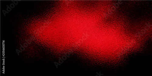 Fotografija Abstract glowing red textured background with deep black border, evoking a sense