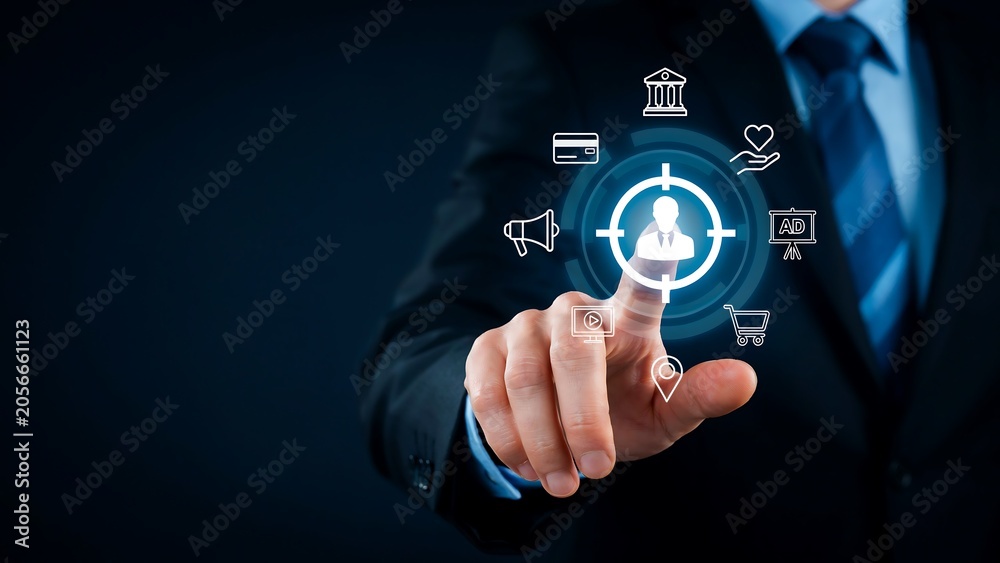 Fototapeta premium Businessman selecting customer target icon on digital interface for marketing strategy
