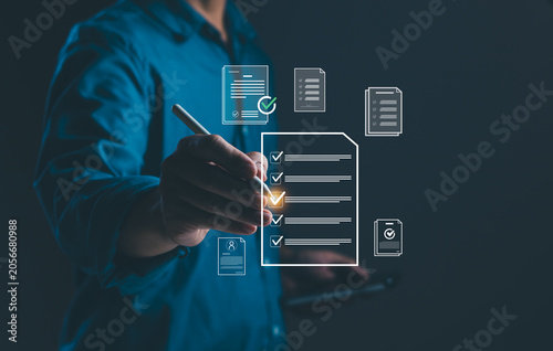 Fotografie Businessman completing digital checklist and document verification process, feat