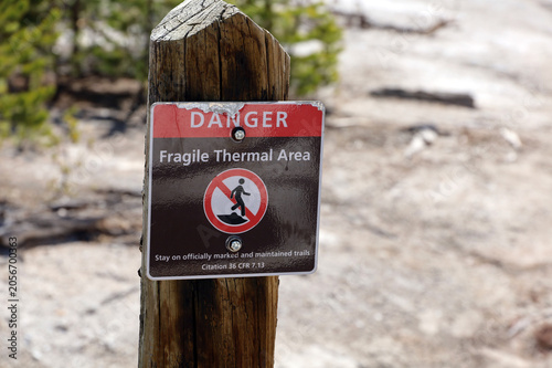 Yellowstone National Park signs warn visitors of areas dangerous to walk on due to subsurface geothermal activity