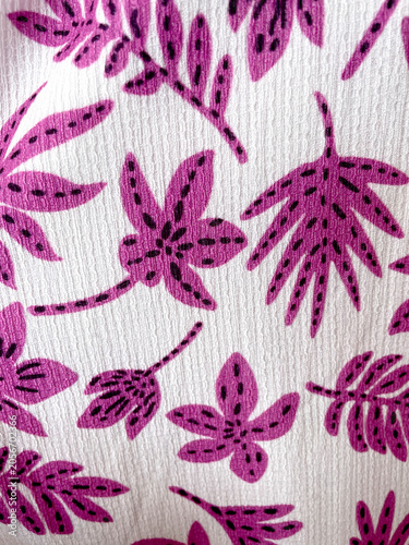 Decorative pink tropical floral pattern on textured white fabric. Stylized leaves and flowers create a playful botanical design, perfect for textiles, wallpaper, packaging, fashion and decor.