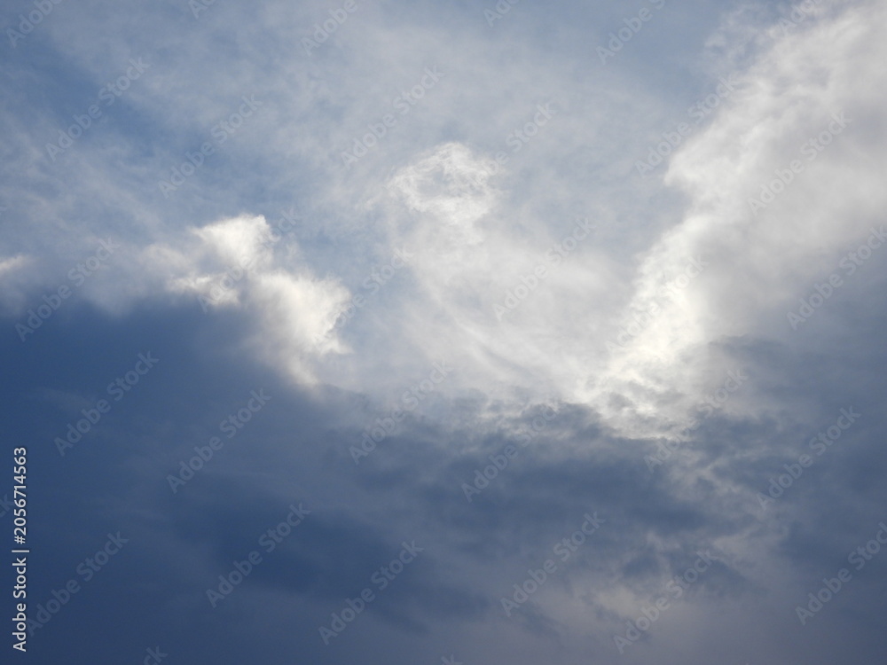 Fototapeta premium Evening sky, with storm clouds, over Kent County, Delaware. Clouds highlighted by the remnants of sunlight at sunset. Tranquil, enlightening background.