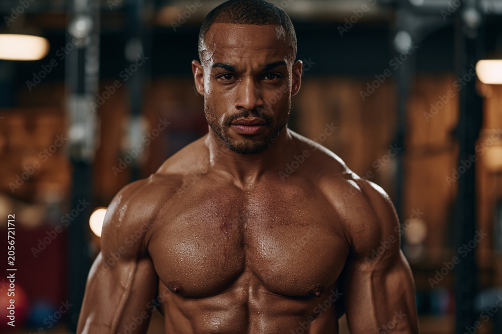 Fototapeta premium Focused Fit Athlete Engaged in Strenuous Weightlifting Session, Demonstrating Strength and Determination in a Dynamic Gym Environment