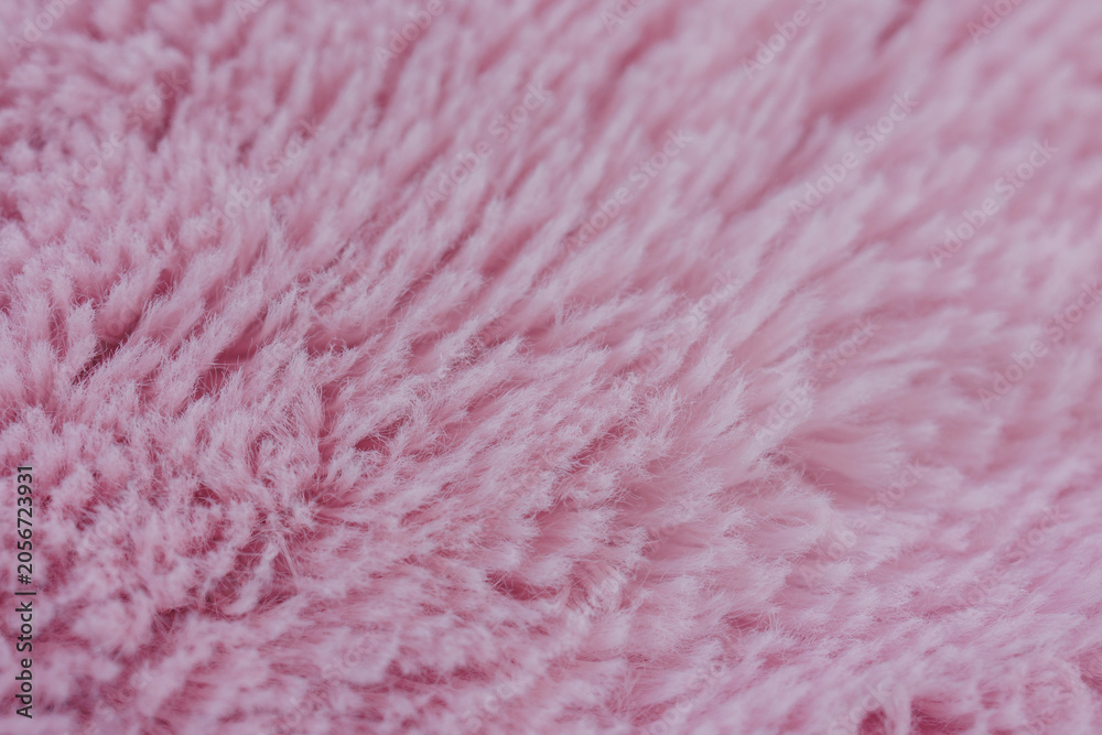 Fototapeta premium Close up view of soft pink shaggy textile surface texture