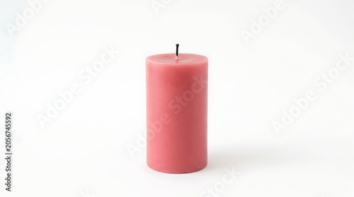 Single pink candle standing upright on pure white background minimalist composition