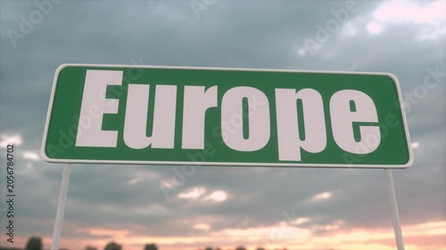Green Europe Road Sign Against Dramatic Cloudy Sunset Sky