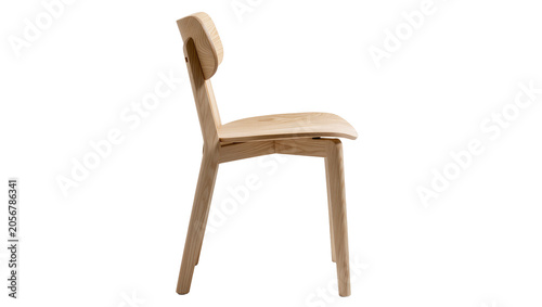 Фотография Isolated modern minimalist natural wood dining chair with curved backrest and se